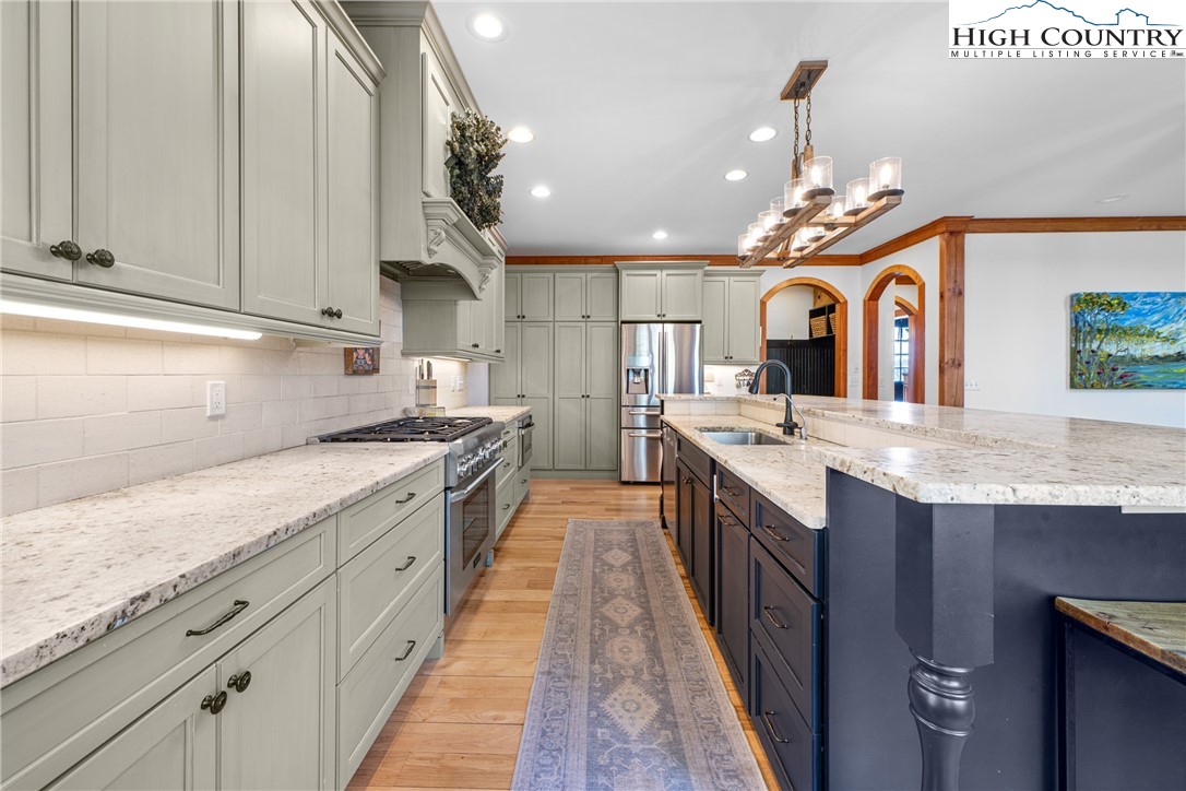 162 Pinecrest Court Boone, NC 28607 - Photo 11 of 50 a large kitchen with granite countertop a large kitchen island and a sink