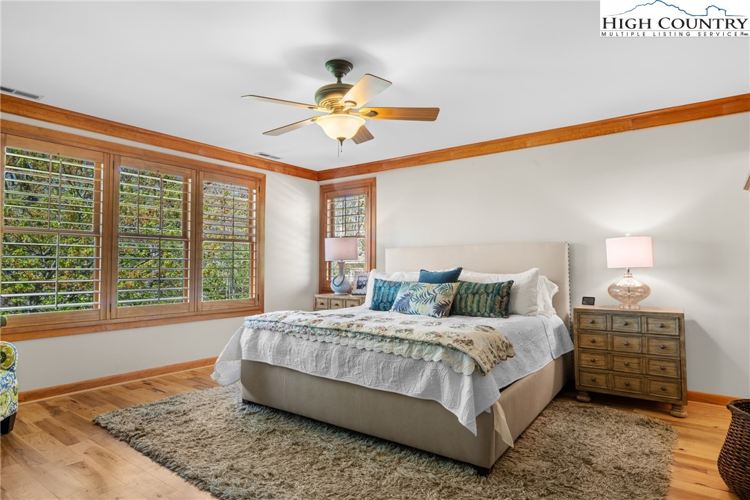 162 Pinecrest Court Boone, NC 28607 - Photo 15 of 50 a bedroom with a bed a chandelier and balcony