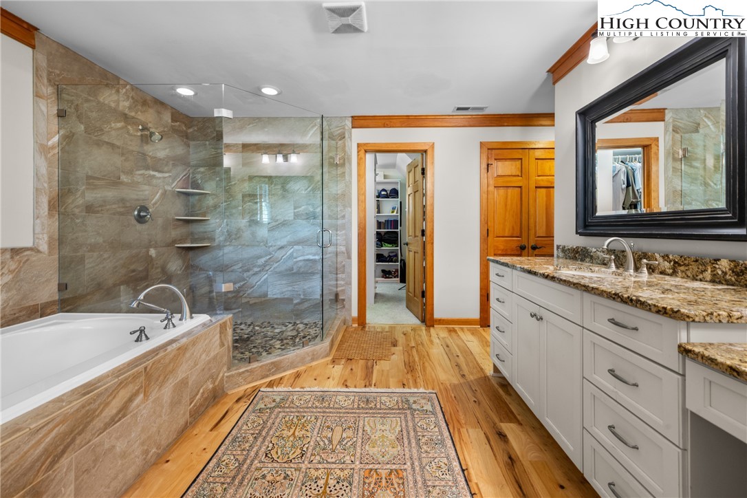 162 Pinecrest Court Boone, NC 28607 - Photo 17 of 50 a bathroom with a granite countertop tub sink shower and mirror