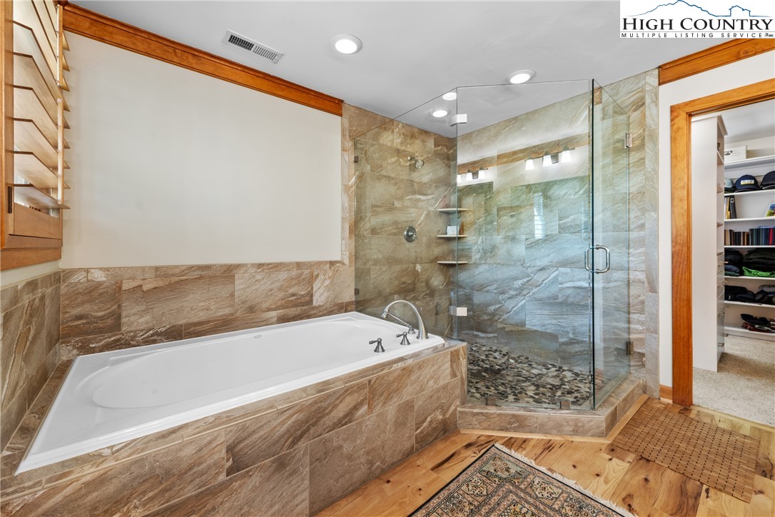 162 Pinecrest Court Boone, NC 28607 - Photo 18 of 50 a bathroom with a bathtub and a shower