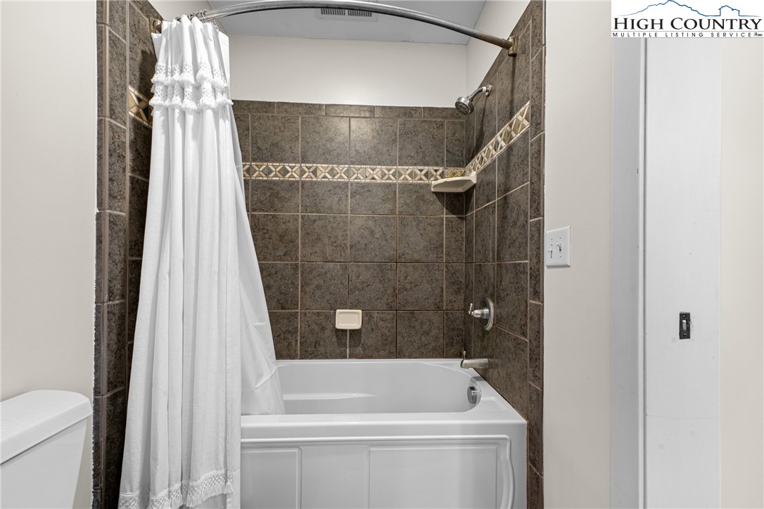 162 Pinecrest Court Boone, NC 28607 - Photo 30 of 50 a bathroom with a shower a toilet and bathtub