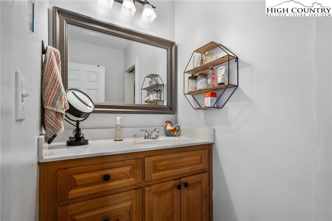 162 Pinecrest Court Boone, NC 28607 - Photo 31 of 50 a bathroom with a sink and a mirror