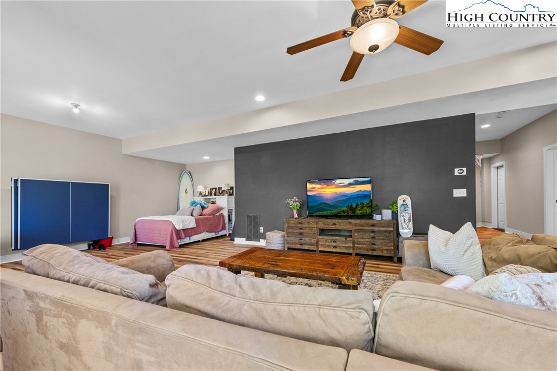 162 Pinecrest Court Boone, NC 28607 - Photo 33 of 50 a bedroom with furniture and a flat screen tv