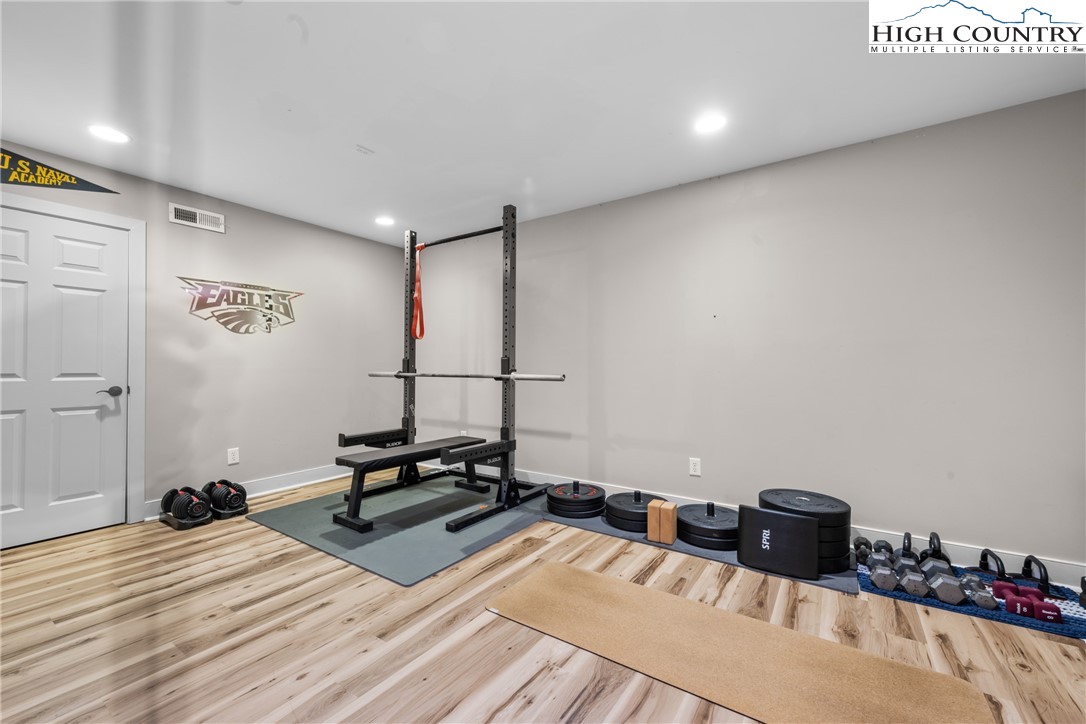 162 Pinecrest Court Boone, NC 28607 - Photo 35 of 50 a bedroom with a bed and a wooden floor