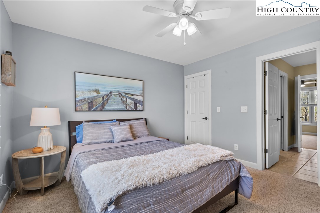 162 Pinecrest Court Boone, NC 28607 - Photo 40 of 50 a bedroom with a bed and a painting on the wall