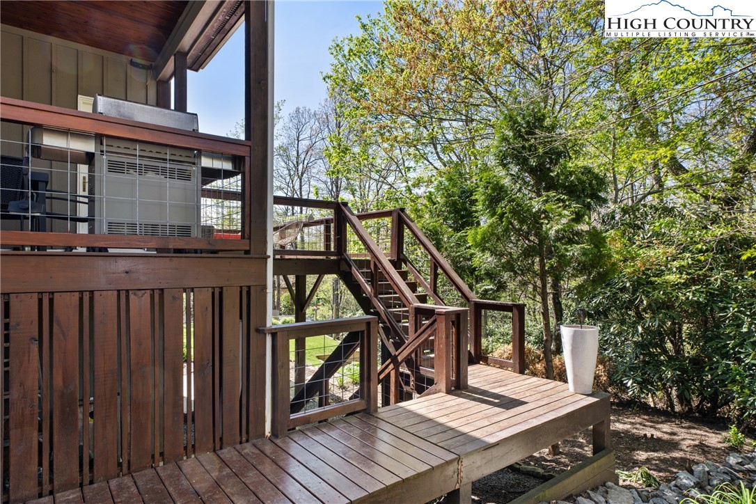 162 Pinecrest Court Boone, NC 28607 - Photo 45 of 50 a view of a wooden deck and a backyard