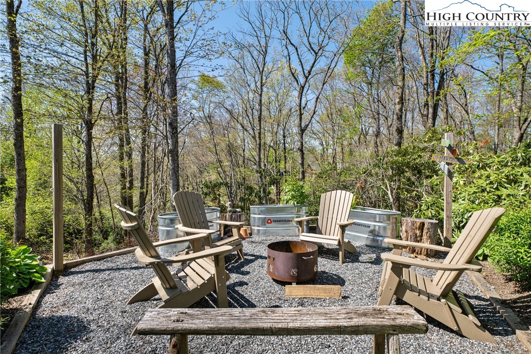 162 Pinecrest Court Boone, NC 28607 - Photo 47 of 50 a view of a backyard with sitting area