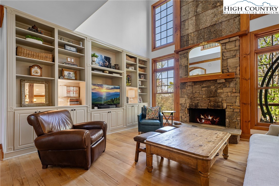 162 Pinecrest Court Boone, NC 28607 - Photo 7 of 50 a living room with furniture a flat screen tv and a fireplace