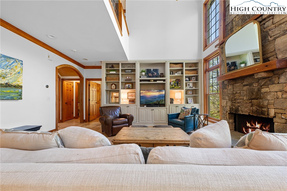 162 Pinecrest Court Boone, NC 28607 - Photo 9 of 50 a living room with furniture fireplace and a large window