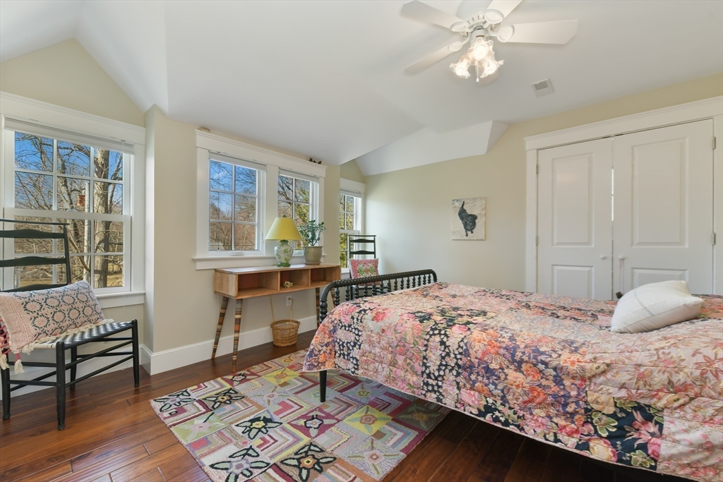 19 Smith Road Hingham, MA 02043 - Photo 11 of 18 a bedroom with a bed and wooden floor