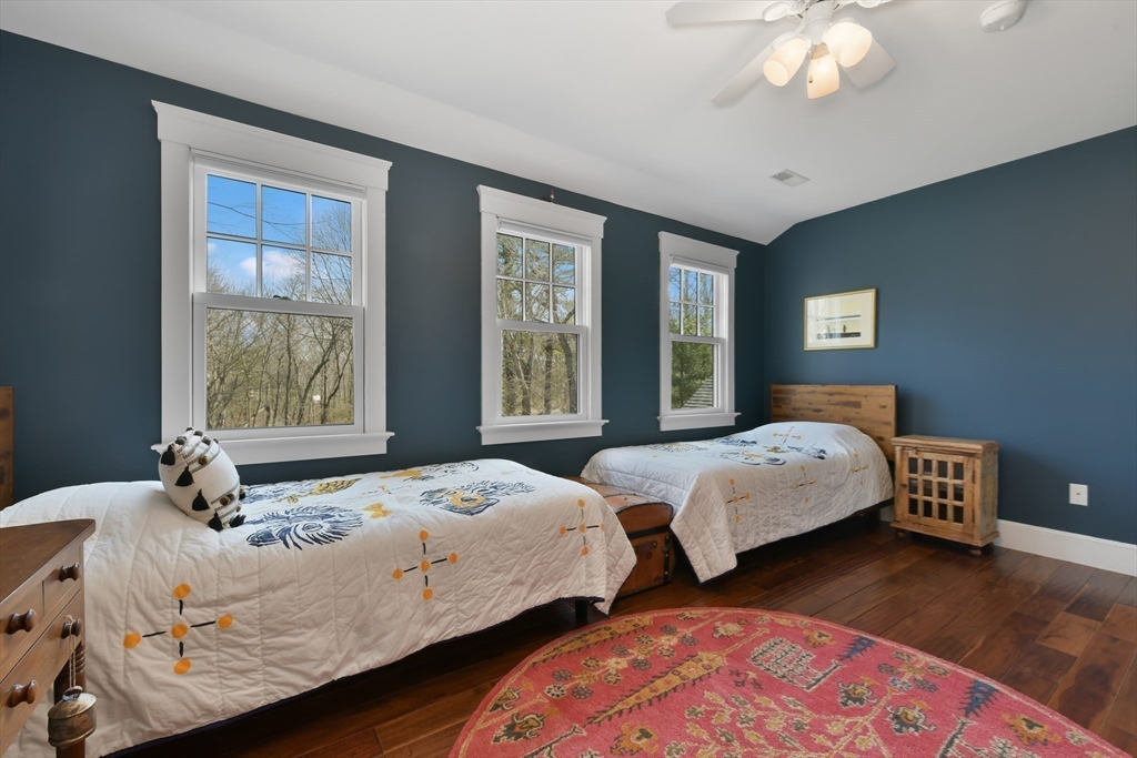 19 Smith Road Hingham, MA 02043 - Photo 12 of 18 a bedroom with two beds and a large window