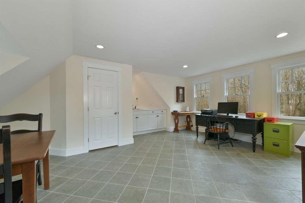 19 Smith Road Hingham, MA 02043 - Photo 15 of 18 a living room with furniture and a dining table