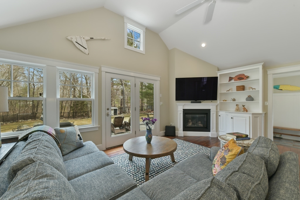 19 Smith Road Hingham, MA 02043 - Photo 5 of 18 a living room with furniture flat screen tv and a fireplace