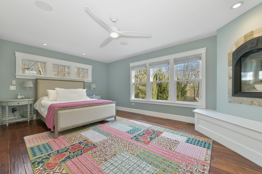 19 Smith Road Hingham, MA 02043 - Photo 8 of 18 a spacious bedroom with a bed wooden floor and a window