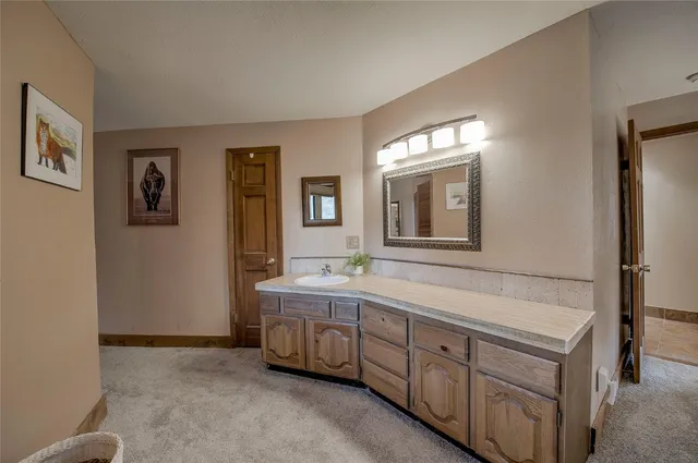 a spacious bathroom with 2 sink tub and a mirror