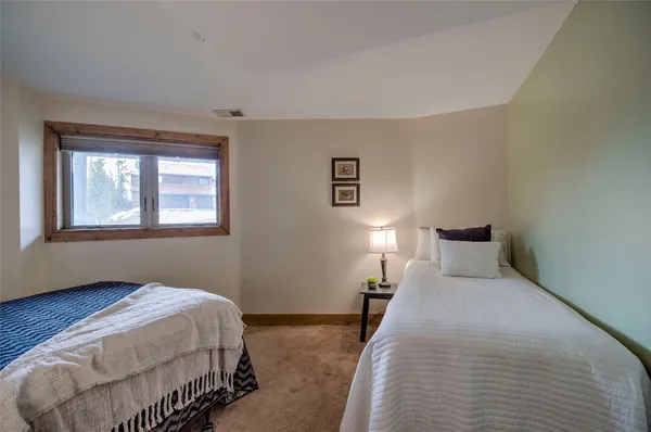 a bedroom with a bed and night stand