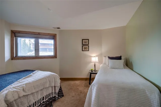 a bedroom with a bed and night stand