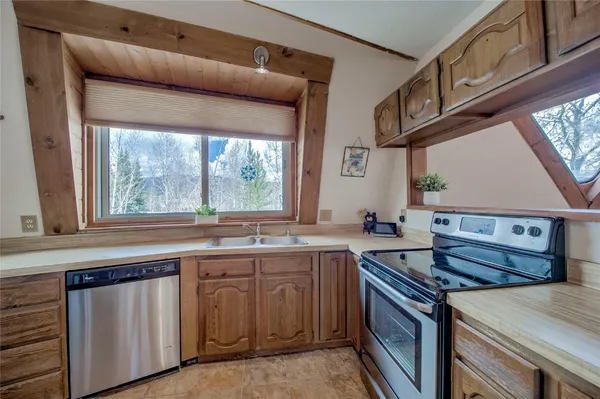 a kitchen with a stove and a sink
