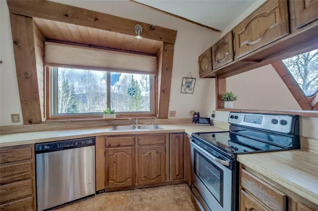 a kitchen with a stove and a sink