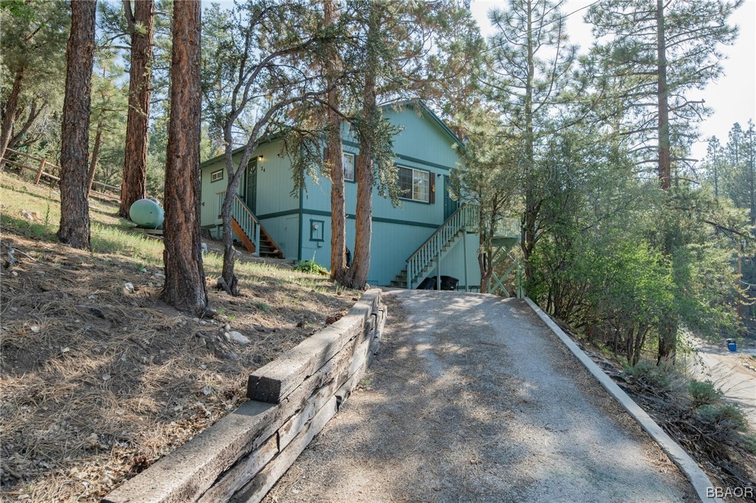 124 Riverside Avenue Sugarloaf, CA 92386 - Photo 3 of 22 a view of a house with a yard