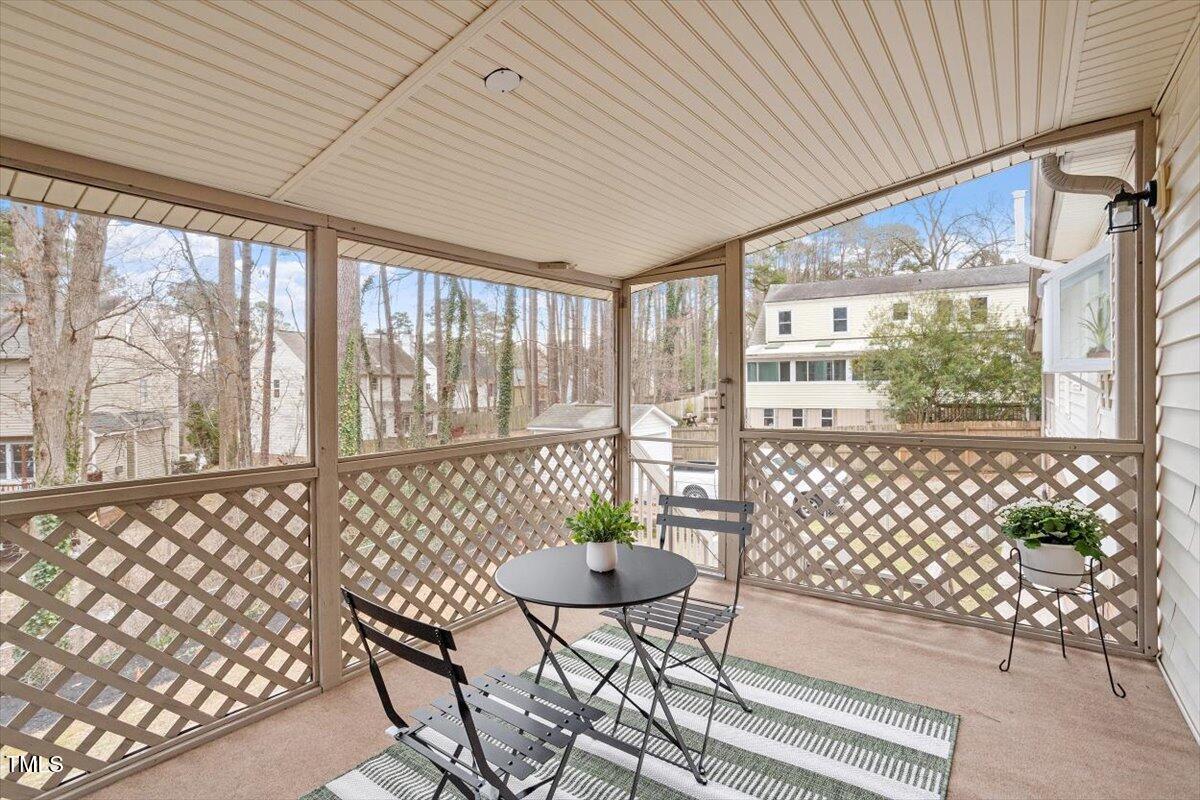 1203 Brookgreen Drive Cary, NC 27511 - Photo 11 of 46 a living room with a large window and table