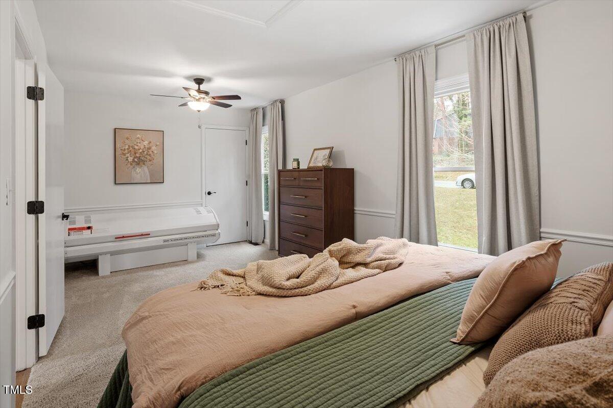 1203 Brookgreen Drive Cary, NC 27511 - Photo 18 of 46 a bedroom with a bed and wooden floor
