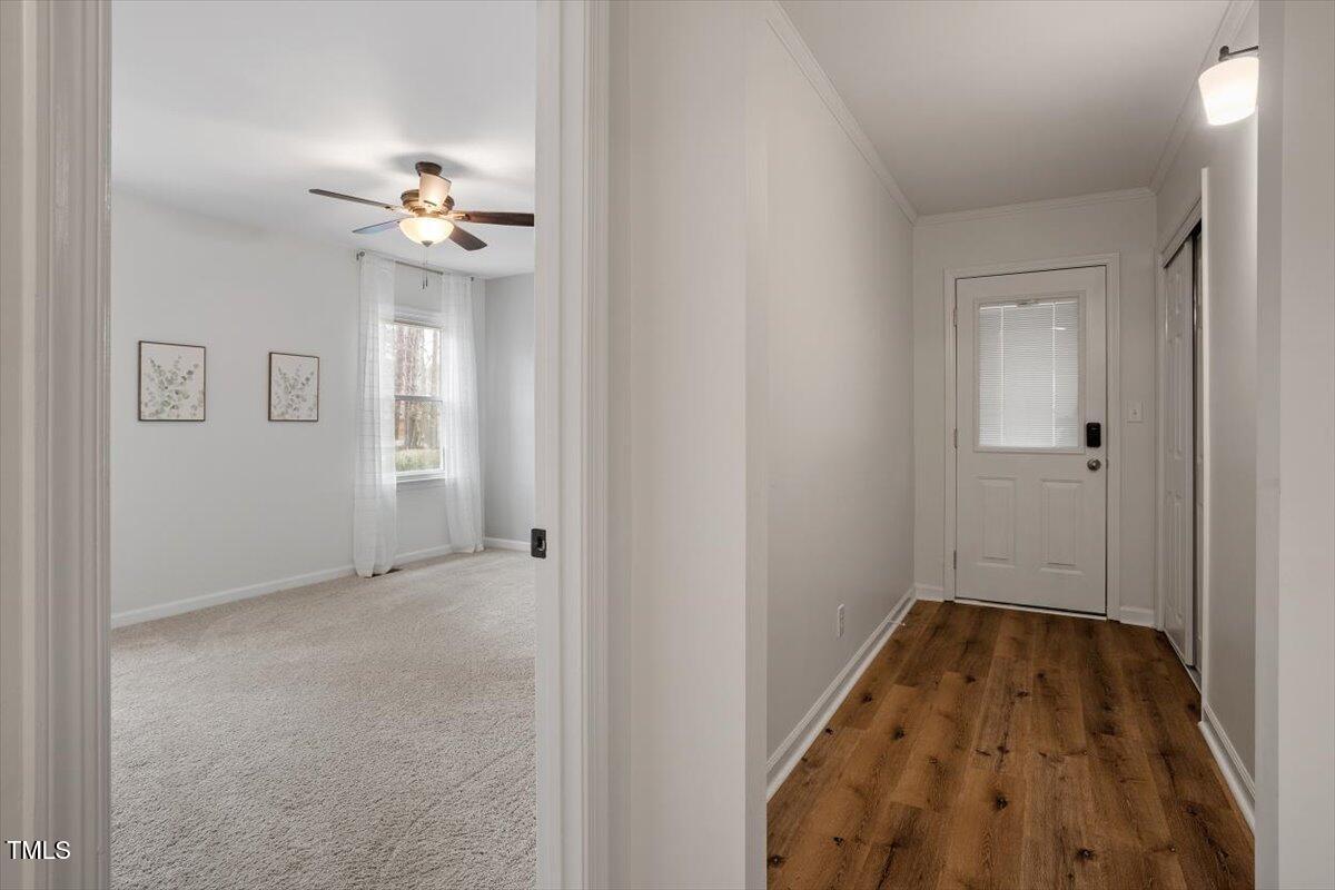 1203 Brookgreen Drive Cary, NC 27511 - Photo 19 of 46 wooden floor in an empty room with a window