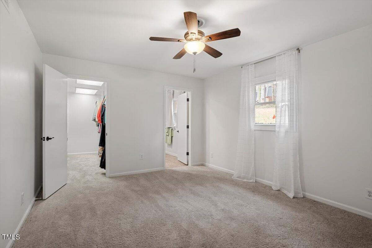 1203 Brookgreen Drive Cary, NC 27511 - Photo 24 of 46 a view of an empty room with a window