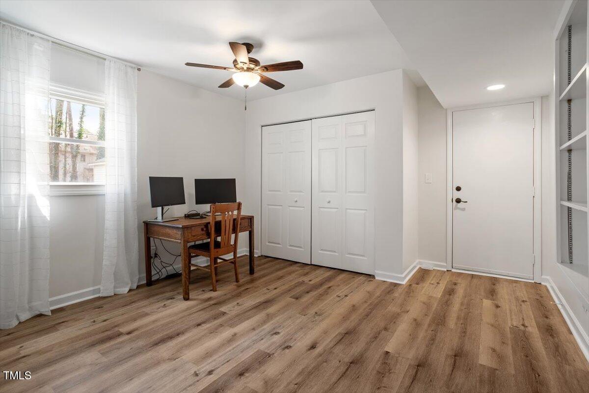 1203 Brookgreen Drive Cary, NC 27511 - Photo 27 of 46 a view of a workspace with furniture and a window