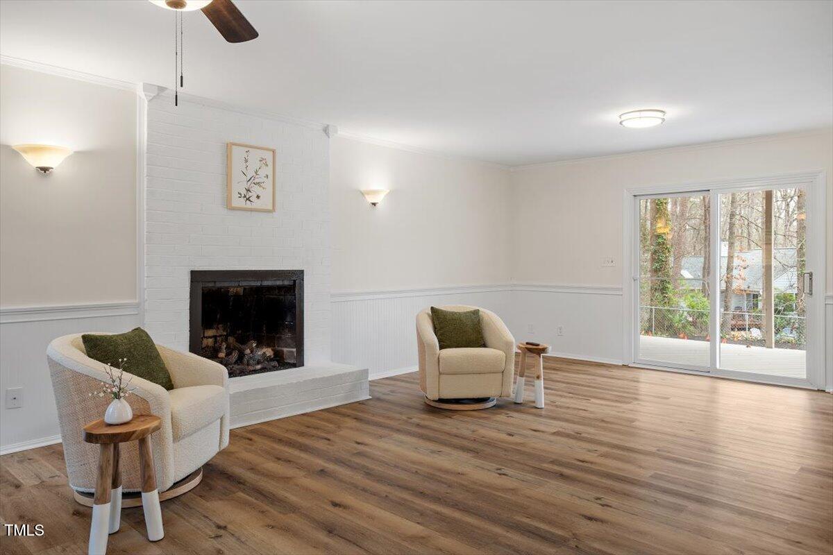 1203 Brookgreen Drive Cary, NC 27511 - Photo 30 of 46 a living room with furniture and a fireplace