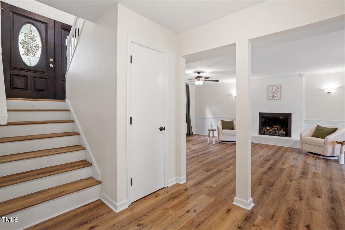 1203 Brookgreen Drive Cary, NC 27511 - Photo 33 of 46 a view of a livingroom with wooden floor and a fireplace