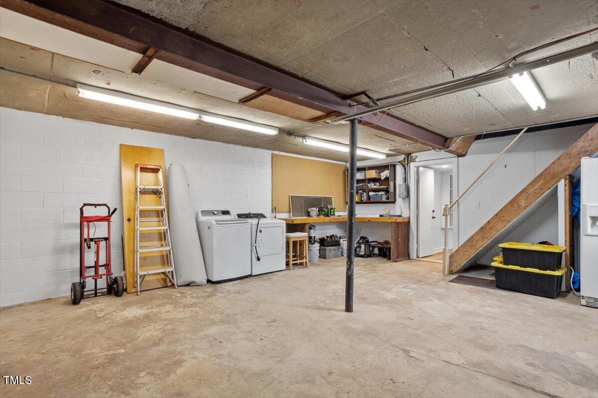 1203 Brookgreen Drive Cary, NC 27511 - Photo 34 of 46 a view of an empty room with wooden floor