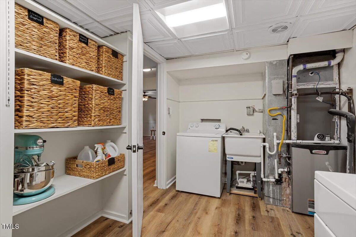1203 Brookgreen Drive Cary, NC 27511 - Photo 38 of 46 a view of kitchen with furniture and wooden floor