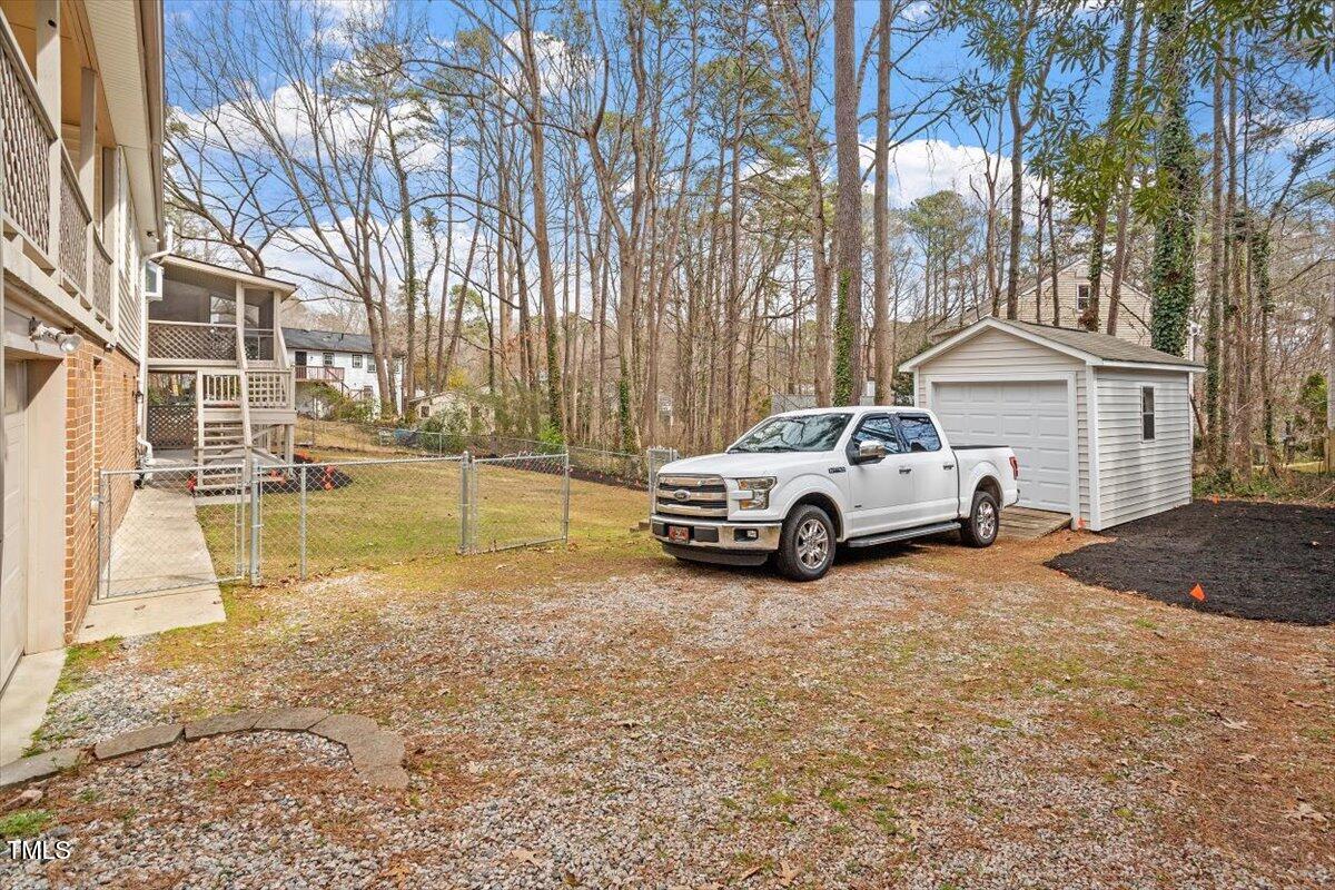 1203 Brookgreen Drive Cary, NC 27511 - Photo 45 of 46 a white house covered with snow in front of it
