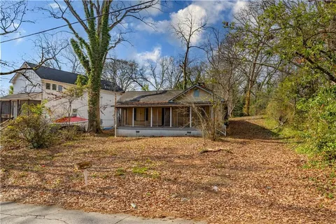 a view of house with yard