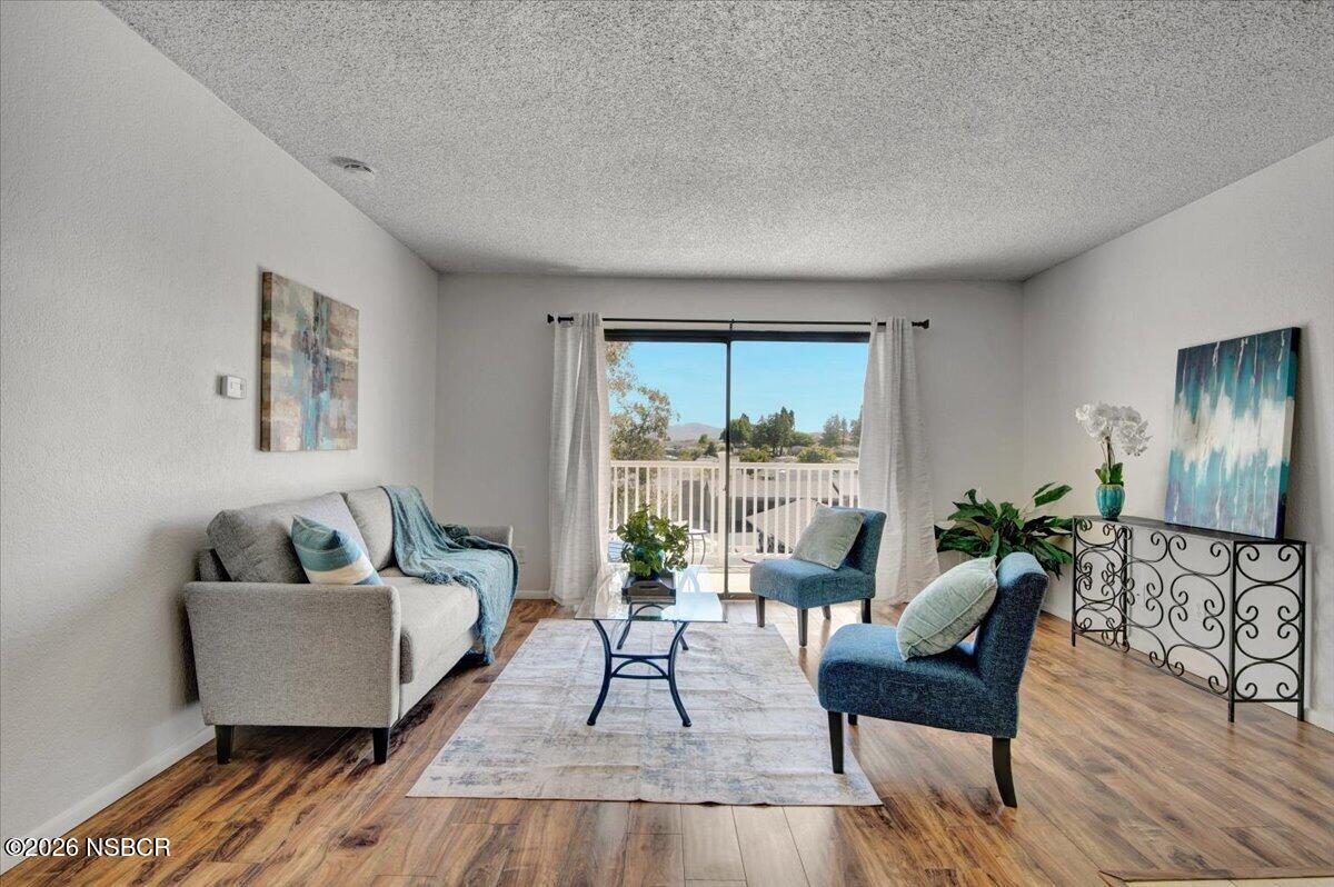 3400 Santa Maria Way, Unit 207B Santa Maria, CA 93455 - Photo 8 of 50 a living room with furniture and a large window