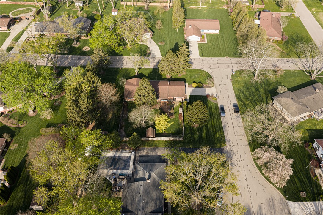 7850 Rain Tree Road Dayton, OH 45459 - Photo 40 of 41 An aerial view showcases a residential neighborhood with ample green space and well-maintained properties.