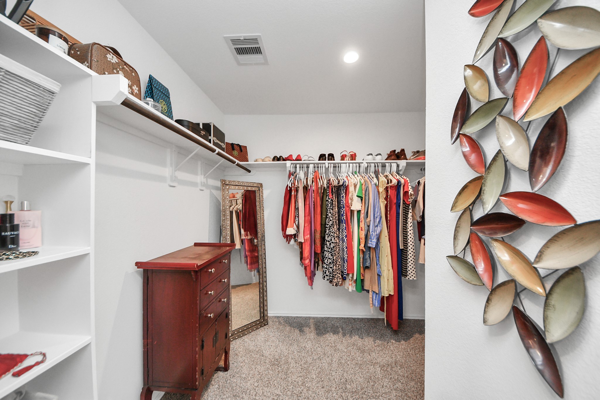 5715 Aspen Acres Drive Spring, TX 77373 - Photo 12 of 24 a view of walk in closet with clothes
