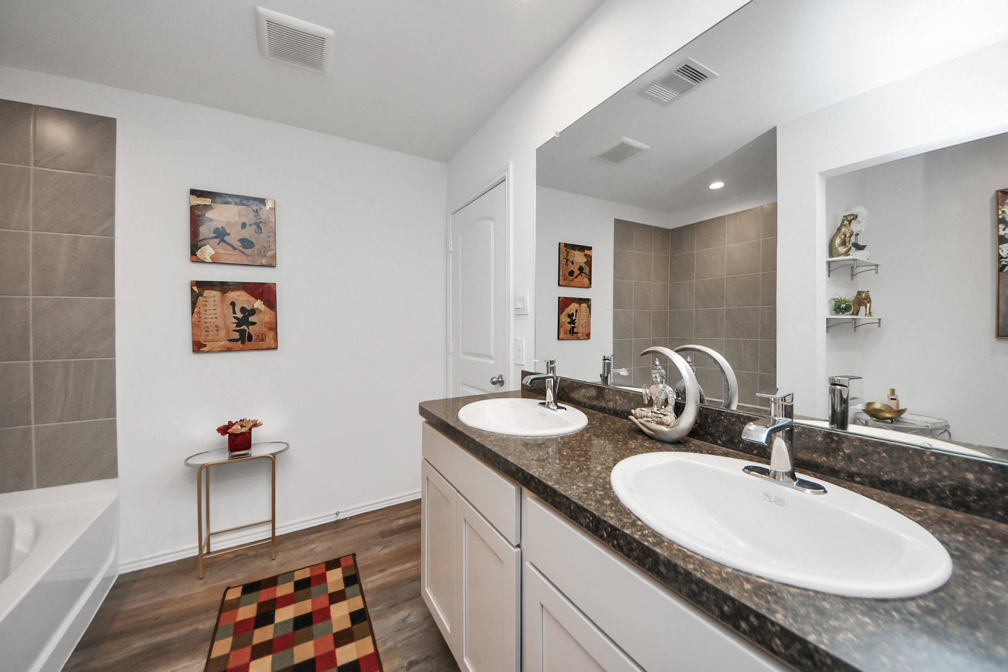 5715 Aspen Acres Drive Spring, TX 77373 - Photo 13 of 24 a bathroom with a granite countertop sink a mirror and a bathtub