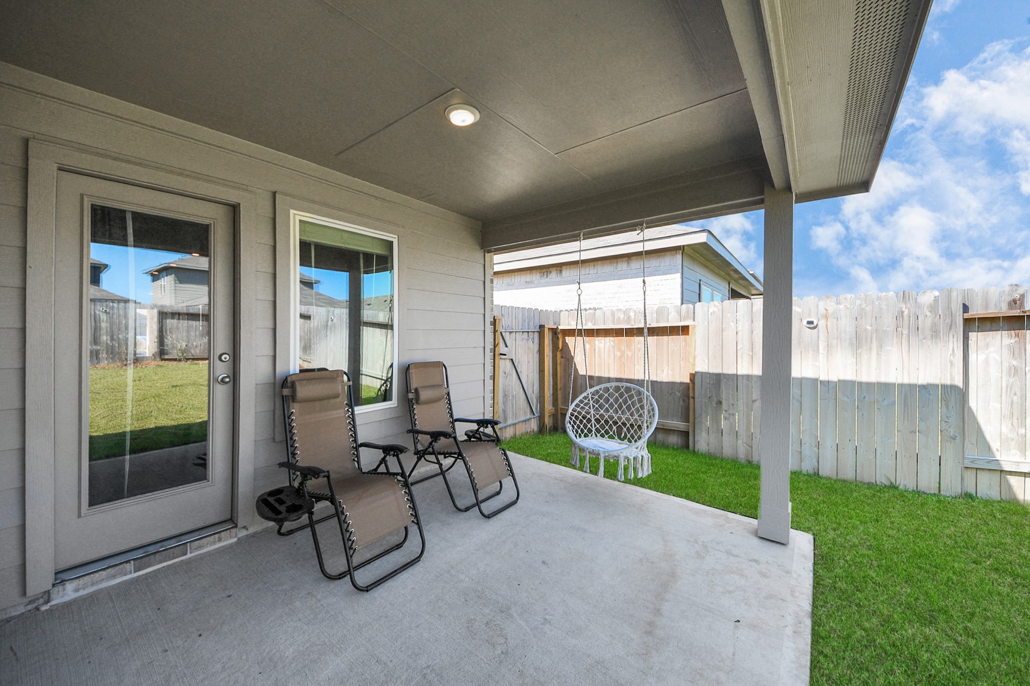 5715 Aspen Acres Drive Spring, TX 77373 - Photo 21 of 24 a view of a porch with chairs and backyard