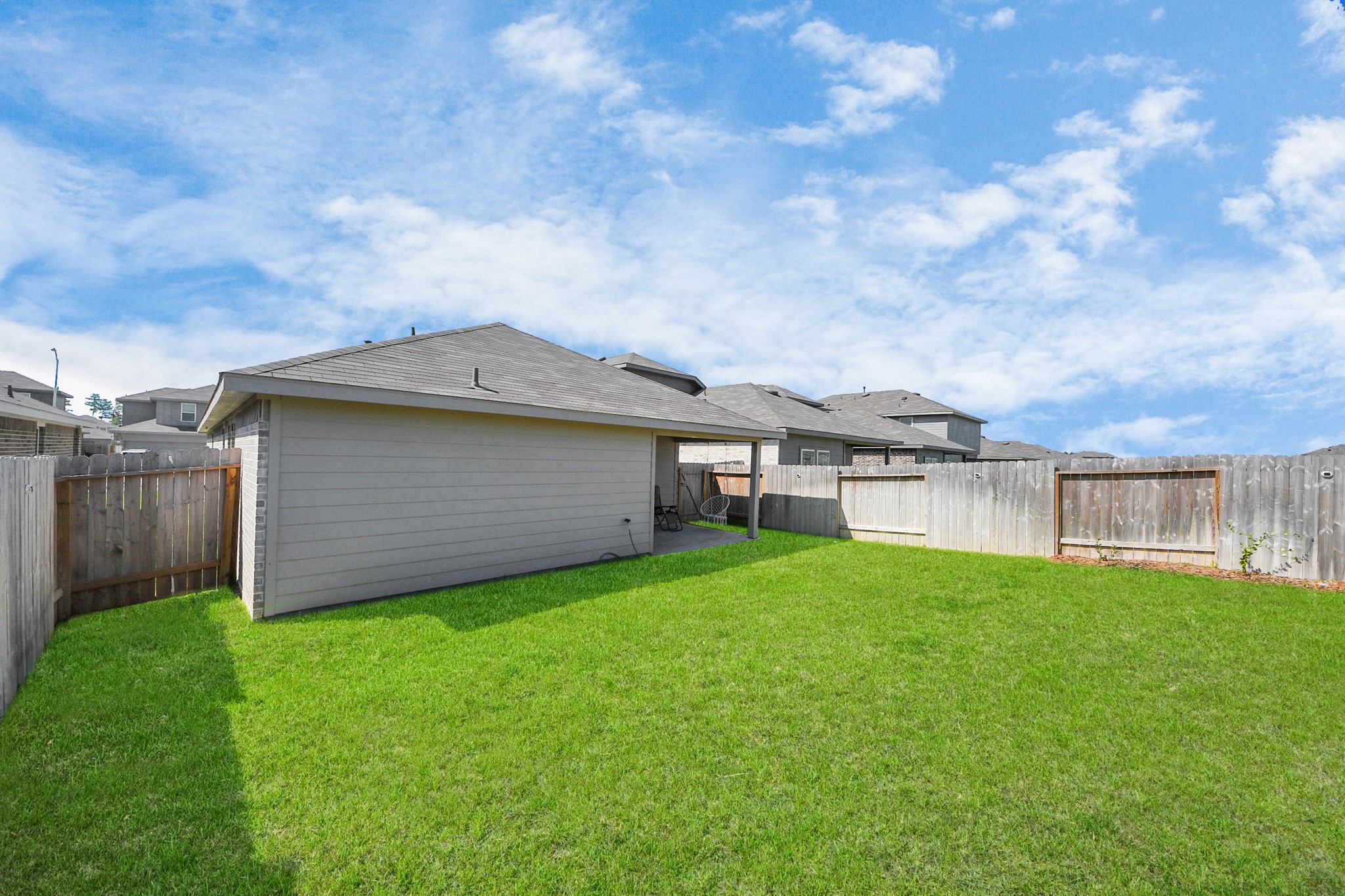5715 Aspen Acres Drive Spring, TX 77373 - Photo 23 of 24 a view of a house with a yard and a large tree