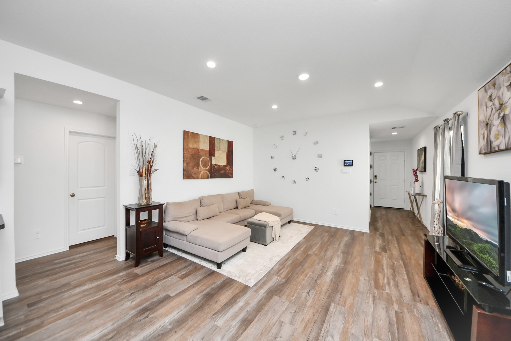 5715 Aspen Acres Drive Spring, TX 77373 - Photo 5 of 24 a living room with furniture and a flat screen tv