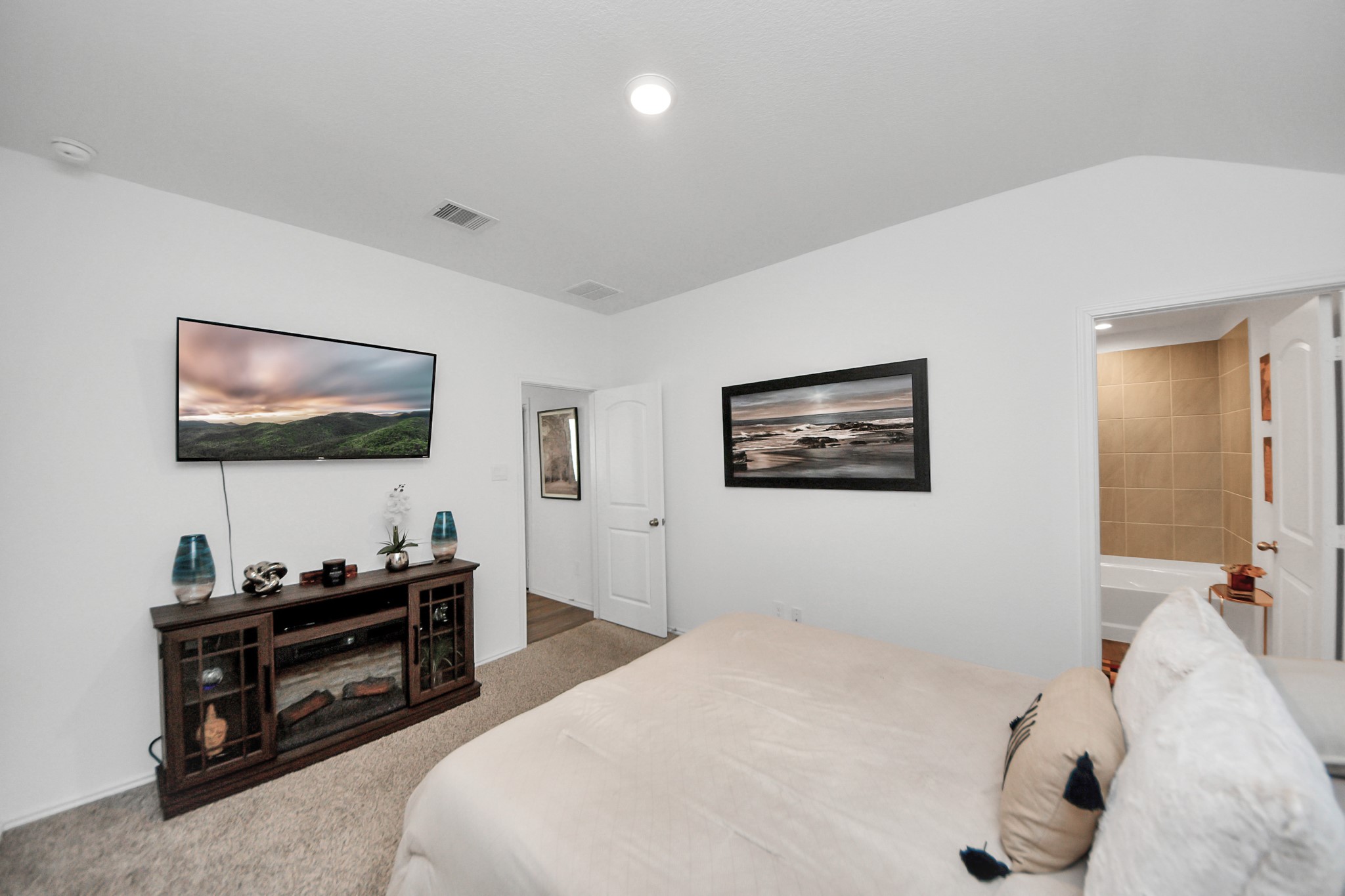 5715 Aspen Acres Drive Spring, TX 77373 - Photo 10 of 24 a bedroom with furniture and a flat screen tv