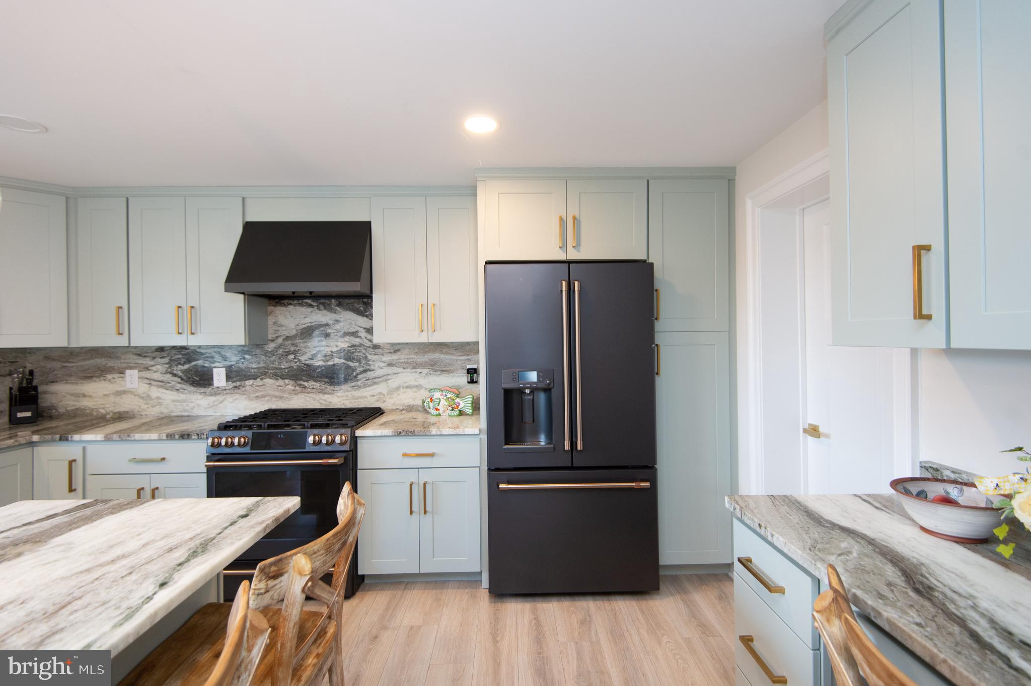 110 Second Street Secretary, MD 21664 - Photo 11 of 36 a kitchen with a refrigerator and a stove top oven