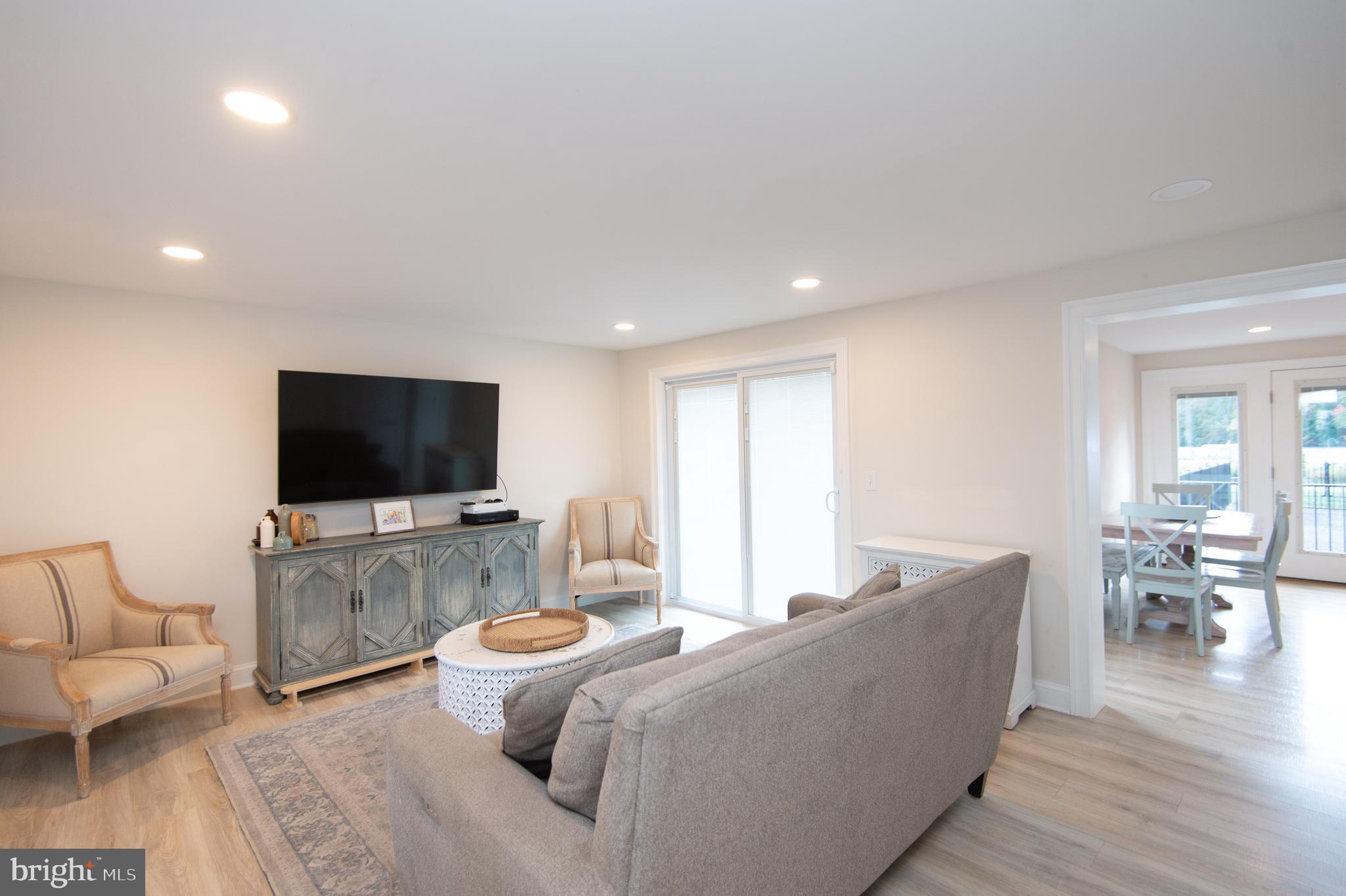110 Second Street Secretary, MD 21664 - Photo 15 of 36 a living room with furniture and a flat screen tv