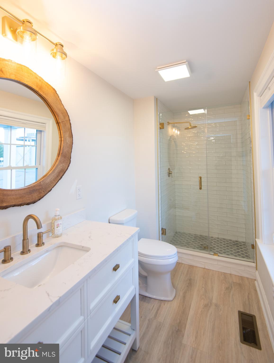 110 Second Street Secretary, MD 21664 - Photo 16 of 36 a bathroom with a sink a toilet and shower