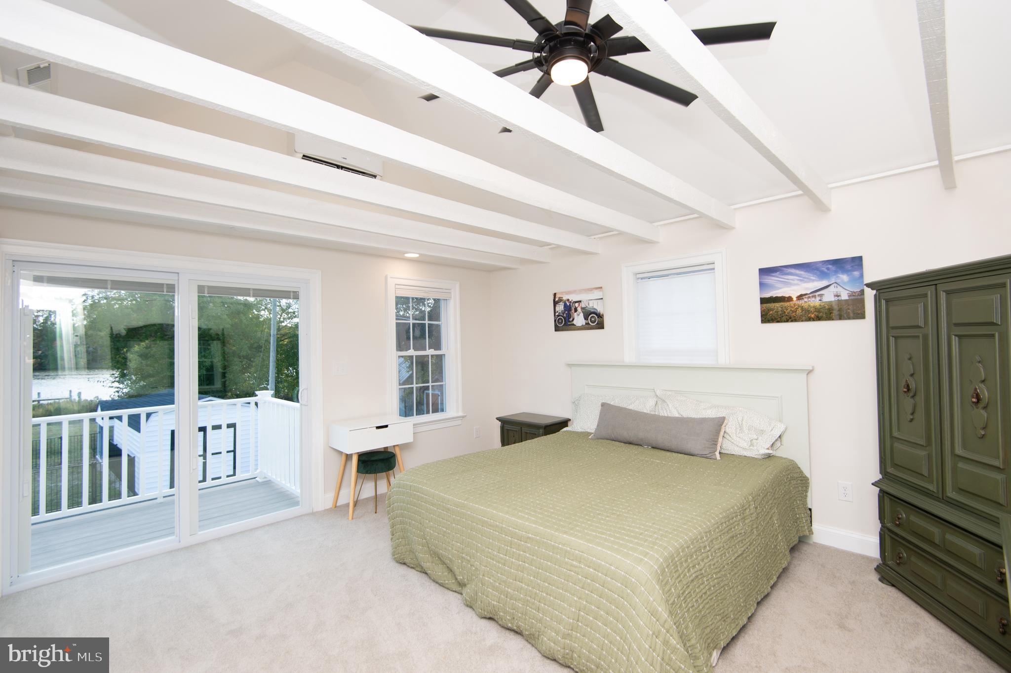 110 Second Street Secretary, MD 21664 - Photo 17 of 36 a bedroom with a large bed and a window
