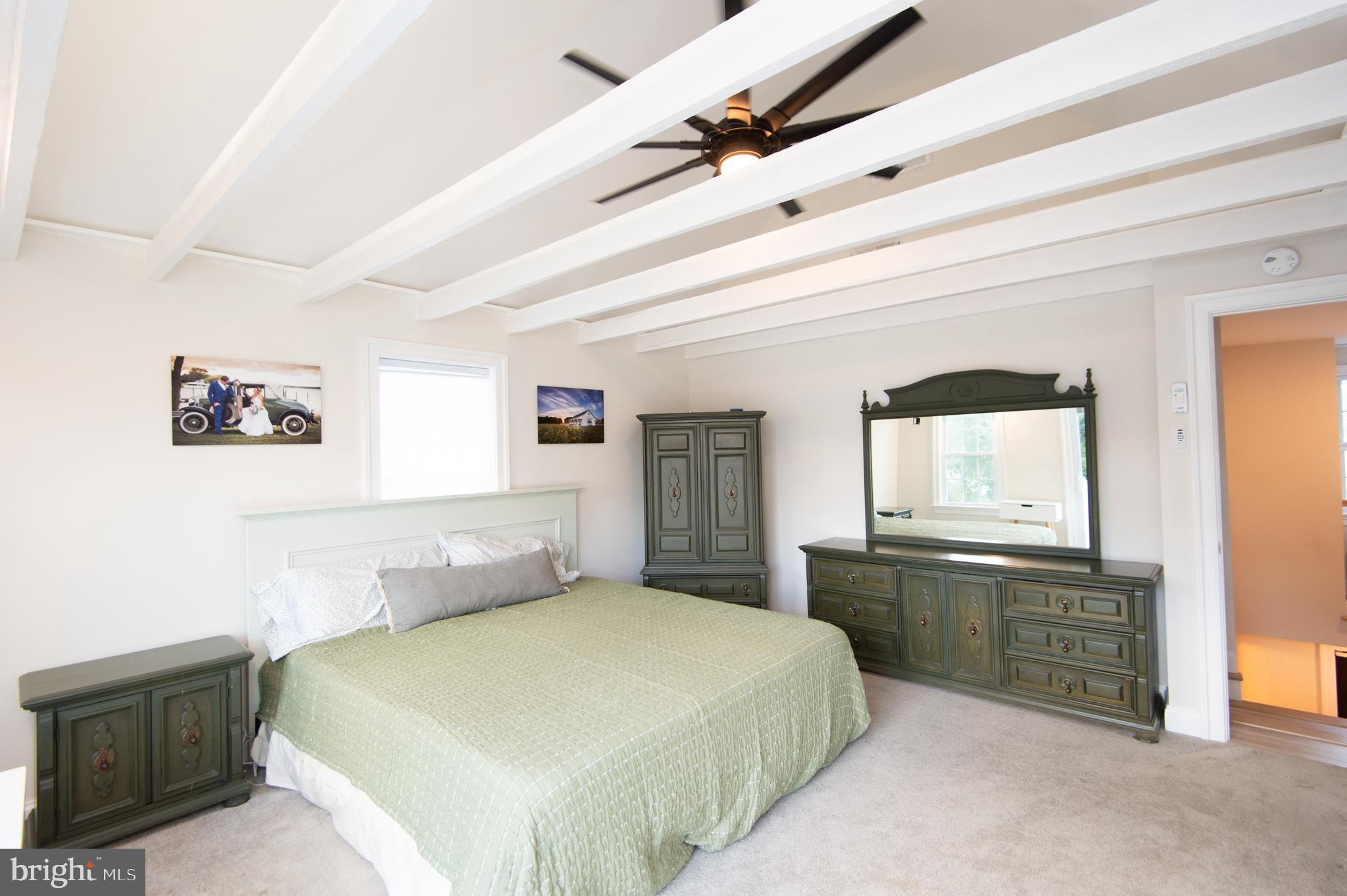 110 Second Street Secretary, MD 21664 - Photo 19 of 36 a bedroom with a bed and a dresser