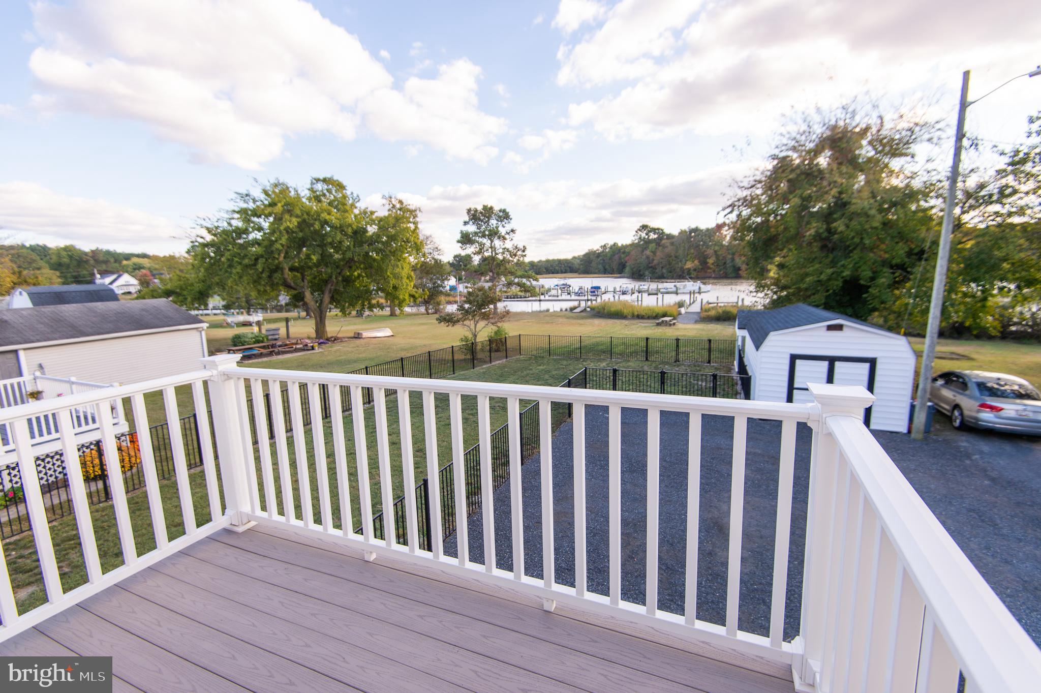 110 Second Street Secretary, MD 21664 - Photo 21 of 36 a balcony with wooden floor and fence