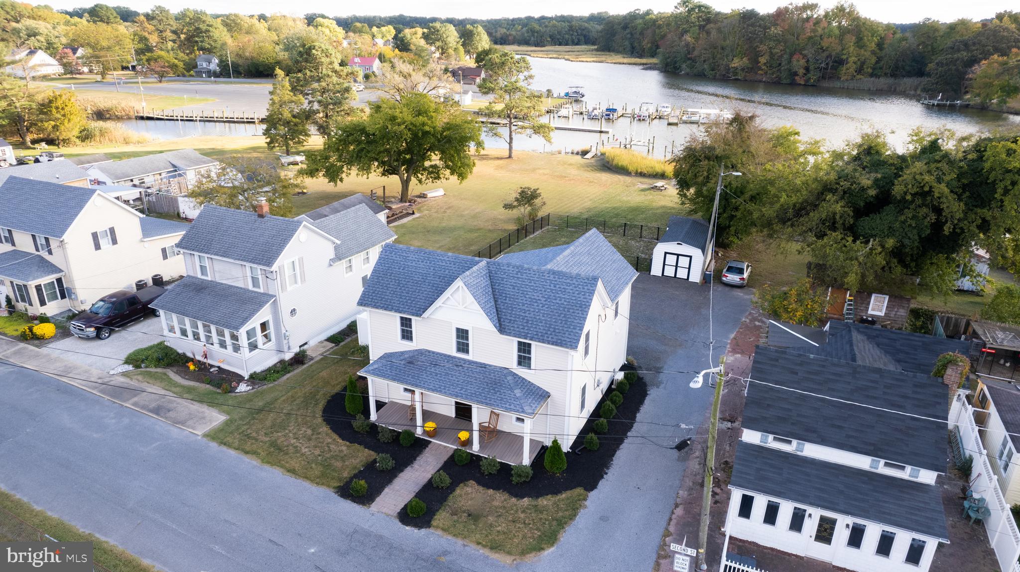 110 Second Street Secretary, MD 21664 - Photo 3 of 36 an aerial view of residential house with outdoor space and lake view